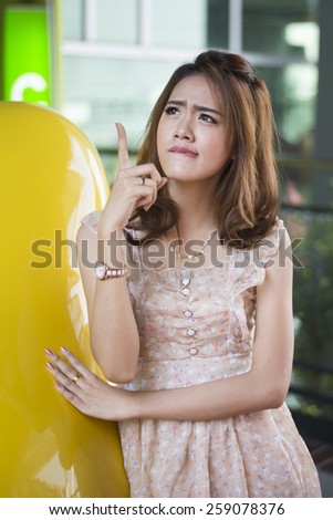 Asian woman thinking in looking pensive  in casual clothes