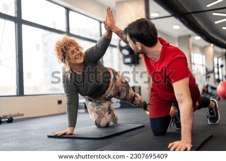 Similar – Image, Stock Photo Female athlete doing push-ups outdoors