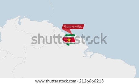 Suriname map highlighted in Suriname flag colors and pin of country capital Paramaribo, map with neighboring American countries.