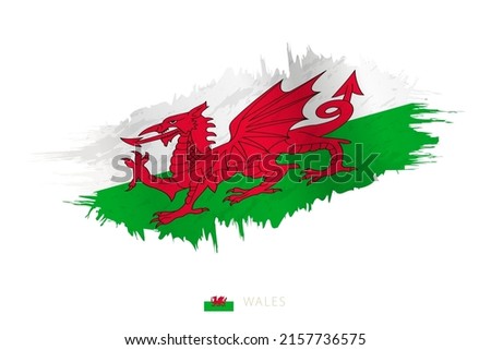 Painted brushstroke flag of Wales with waving effect. Vector flag.