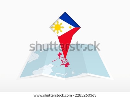 Philippines is depicted on a folded paper map and pinned location marker with flag of Philippines. Folded vector map.