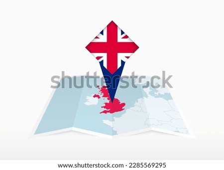 United Kingdom is depicted on a folded paper map and pinned location marker with flag of United Kingdom. Folded vector map.