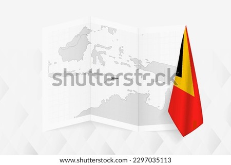 A grayscale map of East Timor with a hanging East Timorese flag on one side. Vector map for many types of news. Vector illustration.