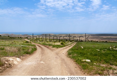 Dirt road fork towards the sea