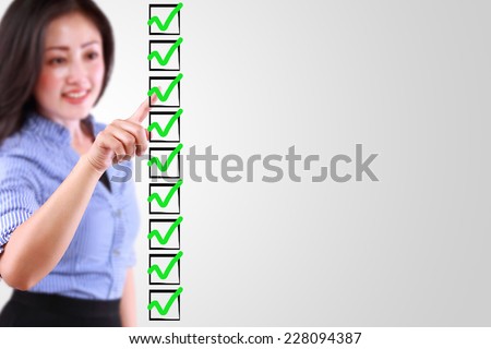 business woman designed on a checklist box