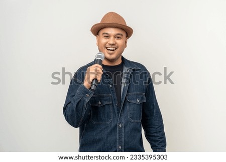 Similar – Image, Stock Photo Man holds a microphone in his hand ready to speak