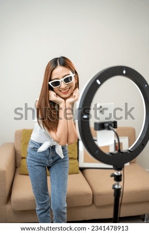 Similar – Image, Stock Photo Fashion blogger recording video at home