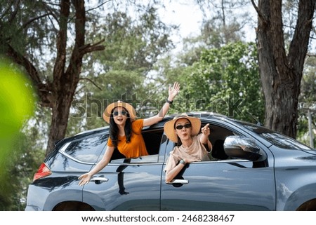 Similar – Image, Stock Photo Calm Asian female traveler standing on suspension bridge over river