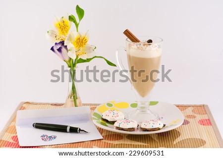 cup of coffee, flowers, letter, pen, cream and cinnamon on a white background