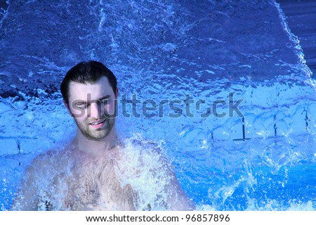 young attractive man relax in spa area