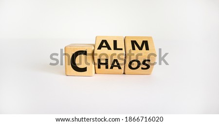 Stop chaos, time to calm. The words 'chaos' and 'calm' on wooden cubes. Beautiful white background, copy space. Business and chaos or calm concept. ストックフォト © 