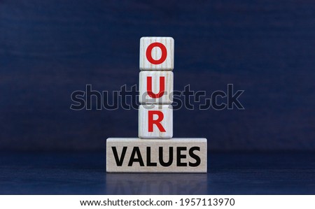 Our values symbol. Wooden cubes and block with words 'our values' on beautiful grey background. Business and our values concept, copy space.