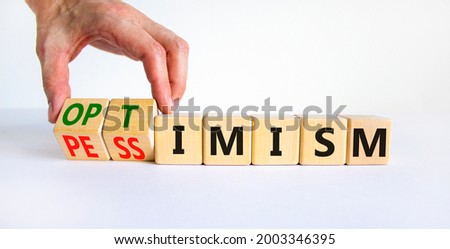 Pessimism or optimism symbol. Businessman turns cubes and changes the word 'pessimism' to 'optimism'. Beautiful white table, white background. Business, optimism or pessimism concept. Copy space. ストックフォト © 