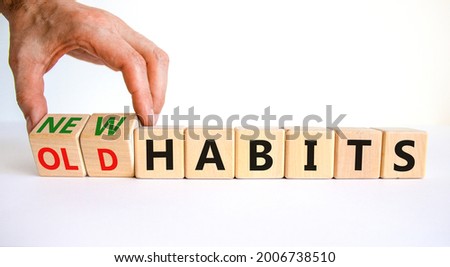 New or old habits symbol. Businessman turns wooden cubes and changes words 'old habits' to 'new habits'. Beautiful white table, white background. Business, old or new habits concept. Copy space. Foto stock © 