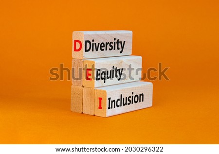 DEI, Diversity, equity, inclusion symbol. Wooden blocks with words DEI, diversity, equity, inclusion on beautiful orange background. Business, DEI, diversity, equity, inclusion concept.