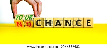 Your or no chance symbol. Businessman turns wooden cubes and changes words 'no chance' to 'your chance'. Beautiful white background, copy space. Business and your or no chance concept.