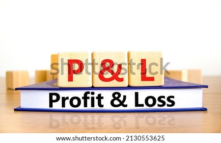P and L profit and loss symbol. Concept words P and L profit and loss on wooden cubes on book on a beautiful wooden table, white background. Business and P and L profit and loss concept. Copy space. Stock fotó © 