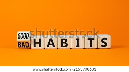 Good or bad habits symbol. Turned wooden cubes and changed concept words Old habits to New habits. Beautiful orange table orange background. Business old or new habits concept. Copy space. Foto d'archivio © 