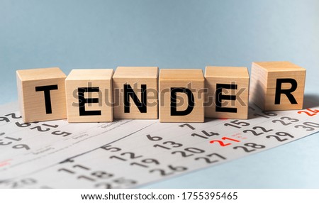 TENDER word on cube block on calendar sheets. date of tender concept Stock foto © 