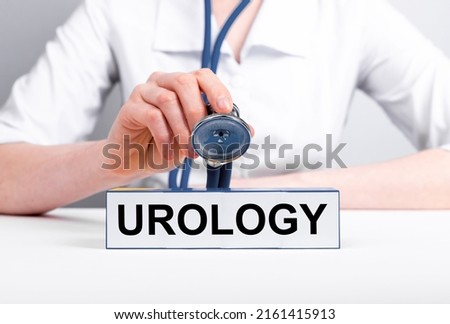 Urology concept. Urologist with stethoscope in hand treating patient. Doctor in lab coat diagnosing, curing kidneys, bladder, prostate, male reproductive organs disorders. High quality photo Stock foto © 