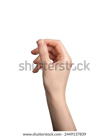 Image, Stock Photo female hand holding small pebble stones in hand near blue sea on a beach background, picking up pebbles on the stone beach, round shape pebbles, summer vacation souvenir, beach day, selective focus