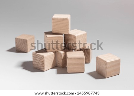 Similar – Image, Stock Photo Small wooden blocks with character icons and a gear shape around them