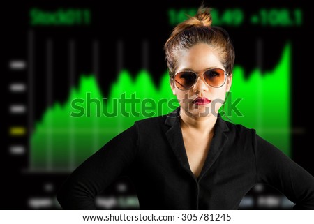 serious face business woman with business growth graph background