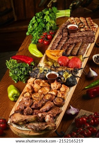 Barbecued meat assorty with mushrooms and chilli  Photo stock © 