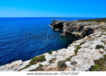 Menorca island Punta Prima Cap de sa Paret background lighthouse of Isla del Aire Foto d'archivio © 