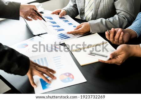 Business team presentation meeting Asian Men Finance Executive discusses meetings to plan work, investment projects, and trading strategy for trading partners. Finance and Accounting
