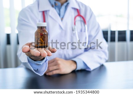 Similar – Image, Stock Photo Pharmacist holding medicine box in pharmacy drugstore.