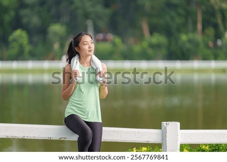 Similar – Image, Stock Photo Sportswoman looking lake from pier