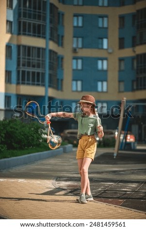 Similar – Foto Bild Mädchen bläst große Seifenblase