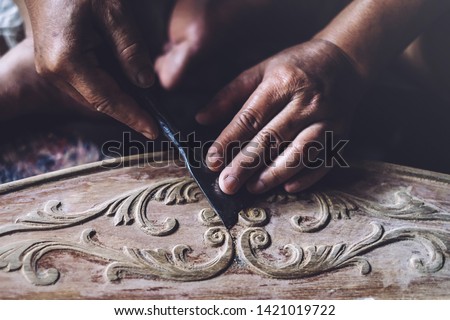 Similar – Foto Bild Handwerker schnitzt Holz in der Werkstatt