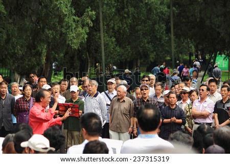 BEIJING, CHINA - JUNE 9, 2013: chinese people sing in park, Beijing, China on 9th June, 2013