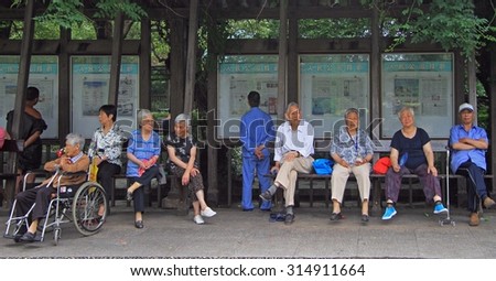SHANGHAI, CHINA - JULY 1, 2015: people are resting in park of Shanghai, China