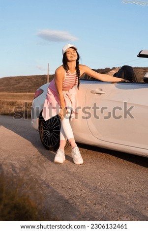 Similar – Image, Stock Photo Woman leaning against door in front of red wall