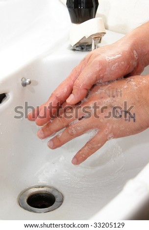 washing hands with h1n1 marks all over hand