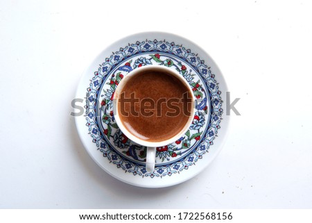 Similar – Image, Stock Photo Turkish espresso pot made of hammered metal stands for coffee preparation on the gas flame of the kitchen stove