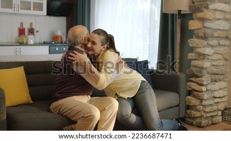 Similar – Image, Stock Photo young woman kissing her dog outdoors in a park with a lake. sunny day, autumn season