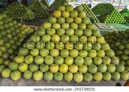 Pomelos on ground, tropical fruit displayed at wholesale fruit market, thailand. The major of thailand\'s fruits