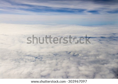 clouds sky, view from the window of an airplane flying in the clouds, top view clouds like an ocean