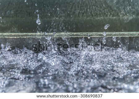 close up water drop splash, Water ventilation outside building/tower with water Flow-through glass