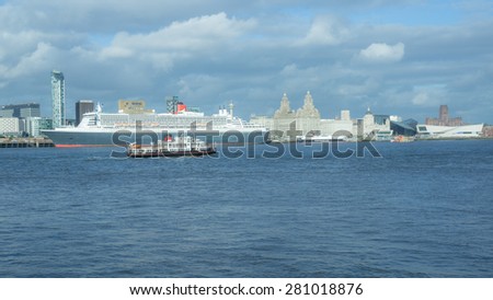 Liverpool, UK - May 24: Queen Mary 2 docks Liverpool and celebrates Cunard\'s 175th anniversary on May 24, 2015. Queen Mary 2 is Cunard\'s flagship ocean line which has a capacity of 2,620 passengers.