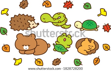 Cute animals hibernating in the fallen leaves