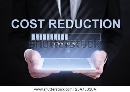businessman holding a tablet with cost reduction loading bar  on the screen. Internet concept. business concept.