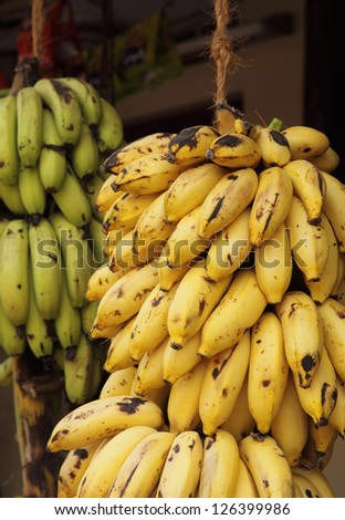 Huge bunches of bananas on sale at a shop in Kerala, South India.