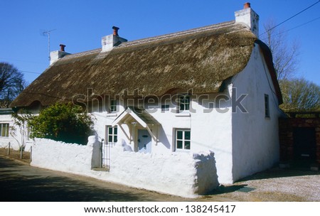 A traditional thatched cottage, several hundred years old, at Oxwich, Gower, South Wales.