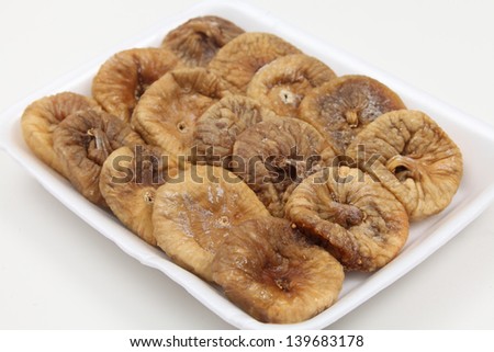 Angled view of a supermarket tray of dried figs