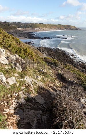 The South Wales Coast Path scrambles round the edge of a cliff near Brandy Bay on the Gower Peninsula.